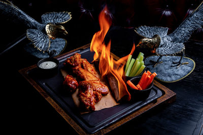 High angle view of meat on barbecue grill