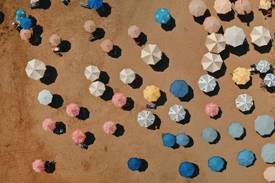 High angle view of multi colored pebbles on sand