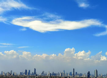 Buildings in city against sky