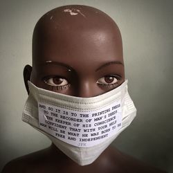 Close-up portrait of mid adult woman against wall