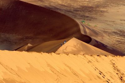 High angle view of people standing at namibian desert