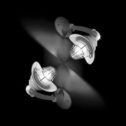 Close-up of illuminated lighting equipment against black background
