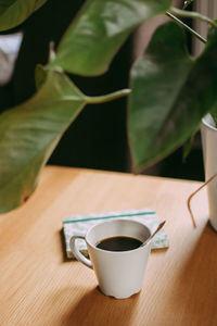 Close-up of coffee cup on table