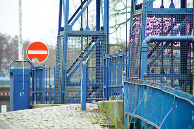 Do not enter sign by blue metallic gate