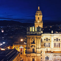 Illuminated buildings in city at night