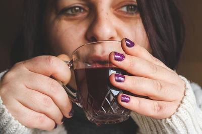 Close up of woman drinking coffee