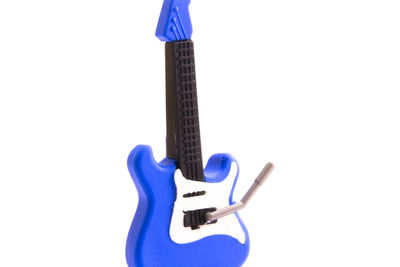 Guitar against white background