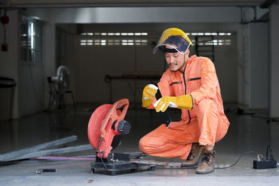 Manual worker working by chainsaw