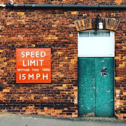 Sign on brick wall