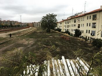 Panoramic shot of trees and buildings against sky