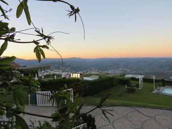 View of townscape against sky at sunset