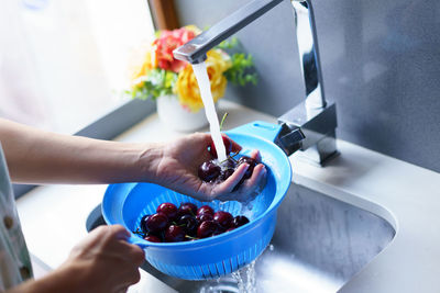 Cropped hand of person preparing food