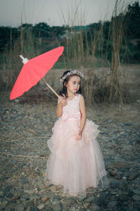 Full length of girl standing on land