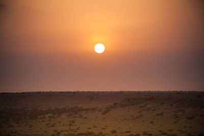 Scenic view of landscape against sky during sunset