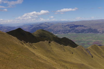 Scenic view of landscape and mountains against sky