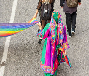 Low section of women standing on road