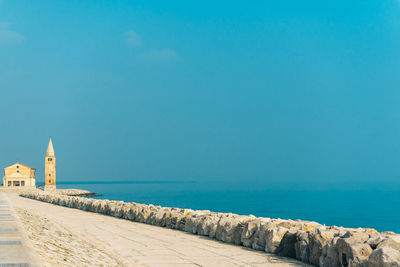 Scenic view of sea against clear blue sky