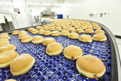 Production line in a baking factory with berliners