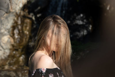 Portrait of woman standing outdoors