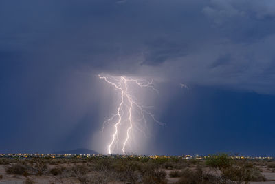 Low angle view of lightning against sky at night