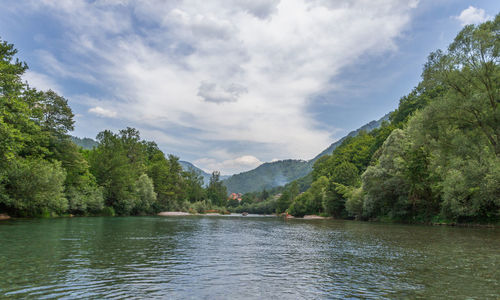 Scenic view of lake and mountains against sky