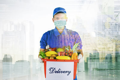 Portrait of man standing with food