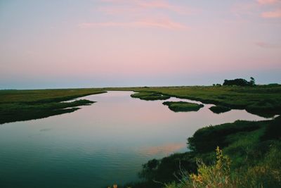Scenic view of lake against sky during sunset