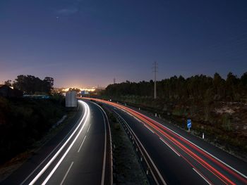 High angle view of light trails on road