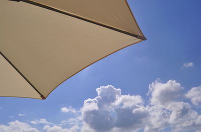 Low angle view of umbrella against sky