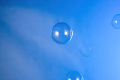 Close-up of bubbles against moon