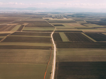 Aerial view of agricultural field against sky