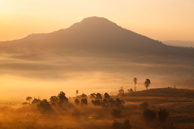 Scenic view of mountains against sky during sunset