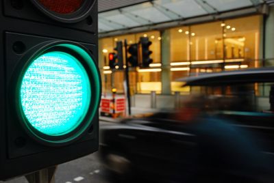 Close-up of road signs in city