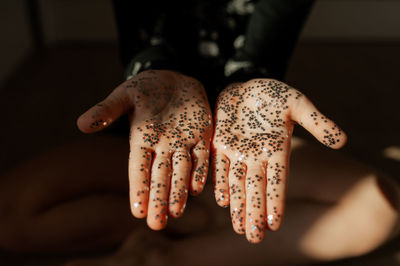 Close-up of woman hand with star shapes