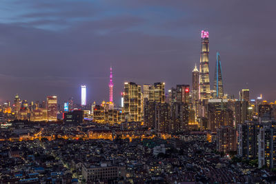 Illuminated city buildings at night