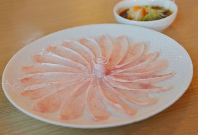 High angle view of fruit in plate on table