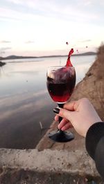 A splash of pomegranate juice in a glass