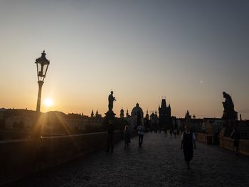 Silhouette of buildings against sky during sunset