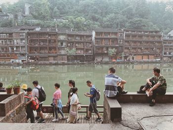 Group of people playing against buildings