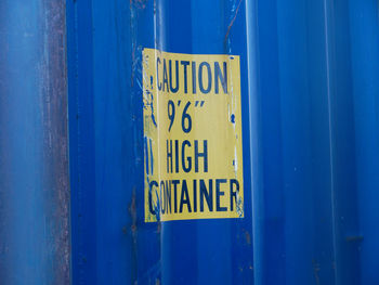 Yellow warning sign on container
