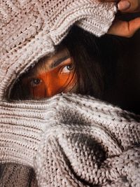 Close-up portrait of woman wearing sweater