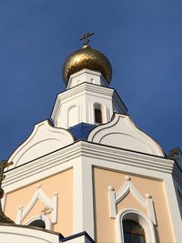 Low angle view of building against blue sky