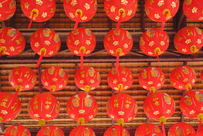 Full frame shot of red lanterns hanging on ceiling