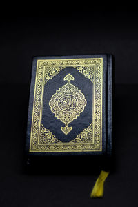 High angle view of text on book against black background