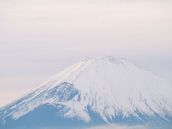 Scenic view of snowcapped mountain against sky