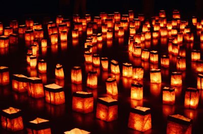 Illuminated candles in temple