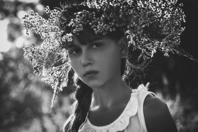 Portrait of woman with plants