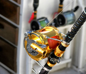 Close-up of a golden fishing reel