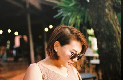 Close-up of young woman wearing sunglasses