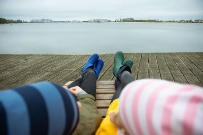 Low section of people relaxing in lake